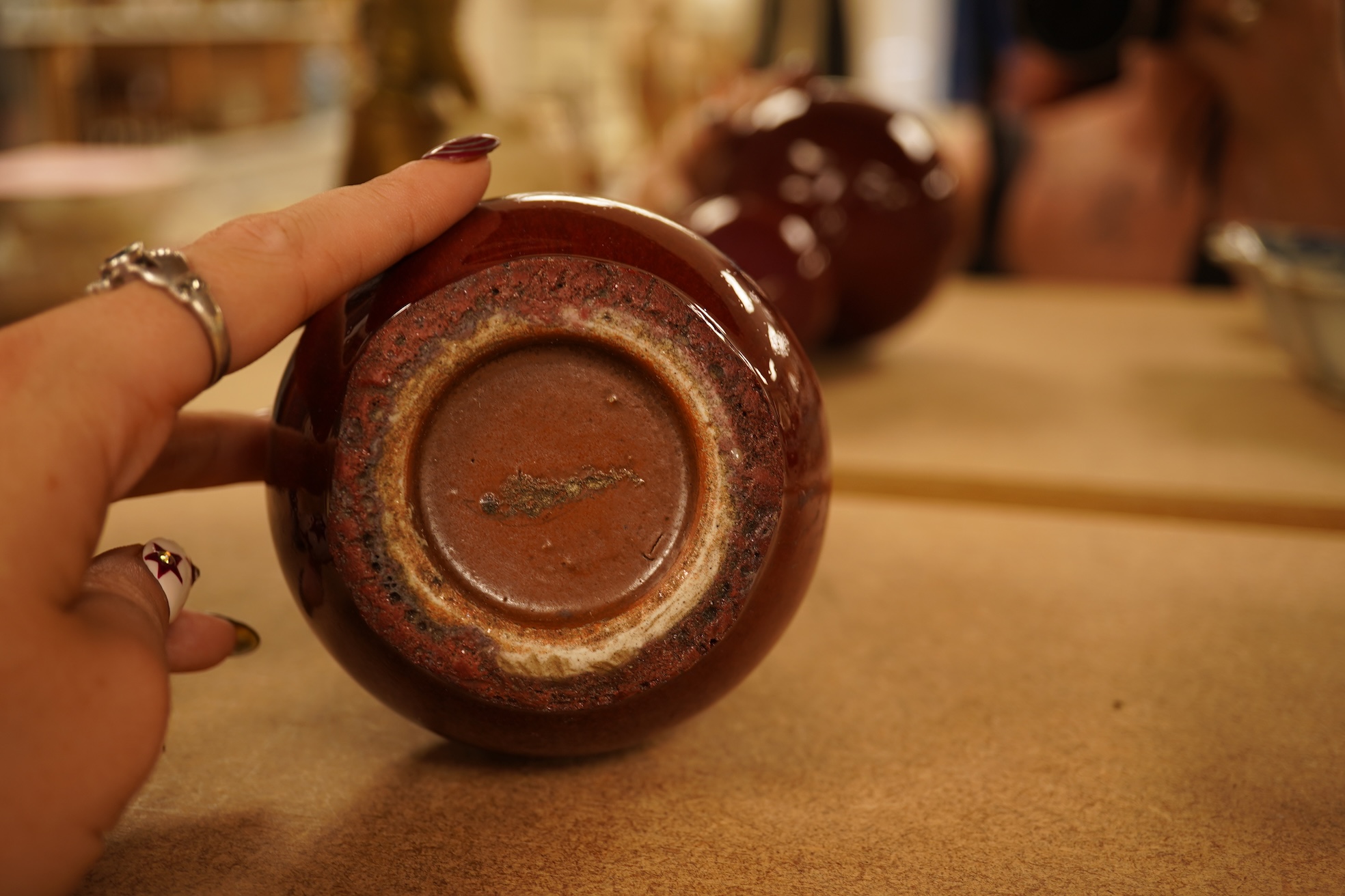 A Chinese Sang De Boeuf glazed double gourd vase, 14.5cm high